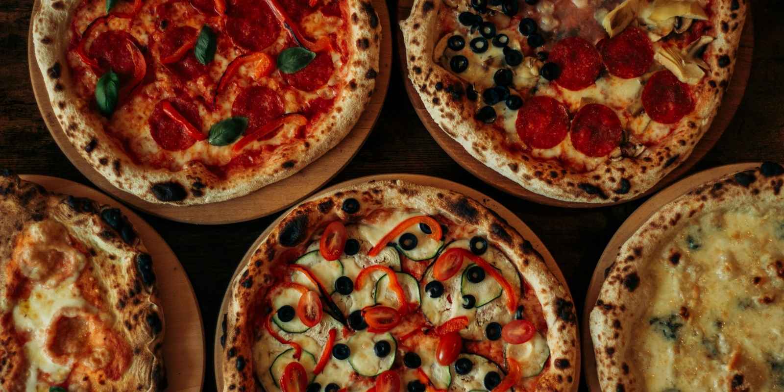 A selection of freshly cooked woodfire pizzas